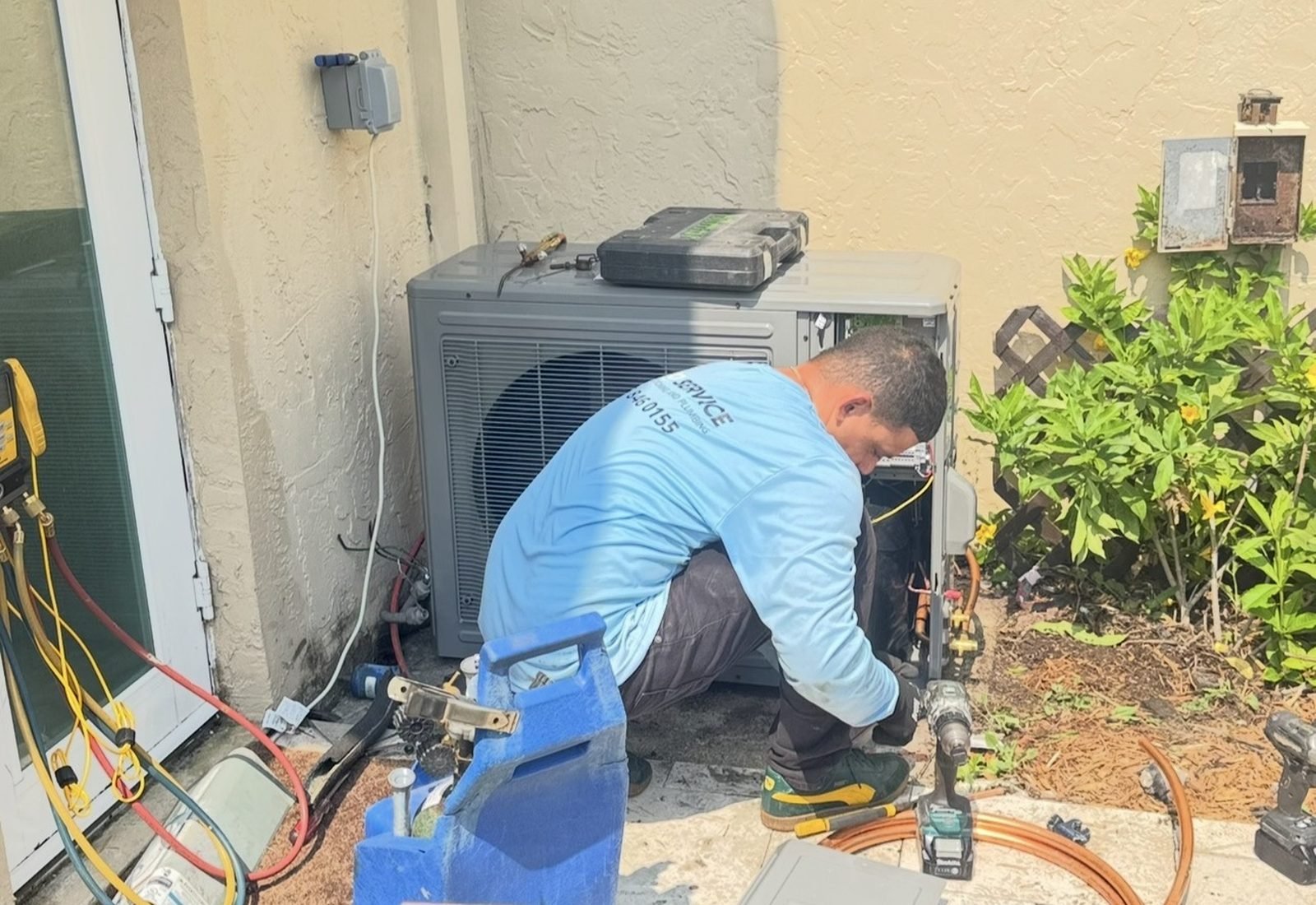 Airo Service technician checking system operation at a South Florida home