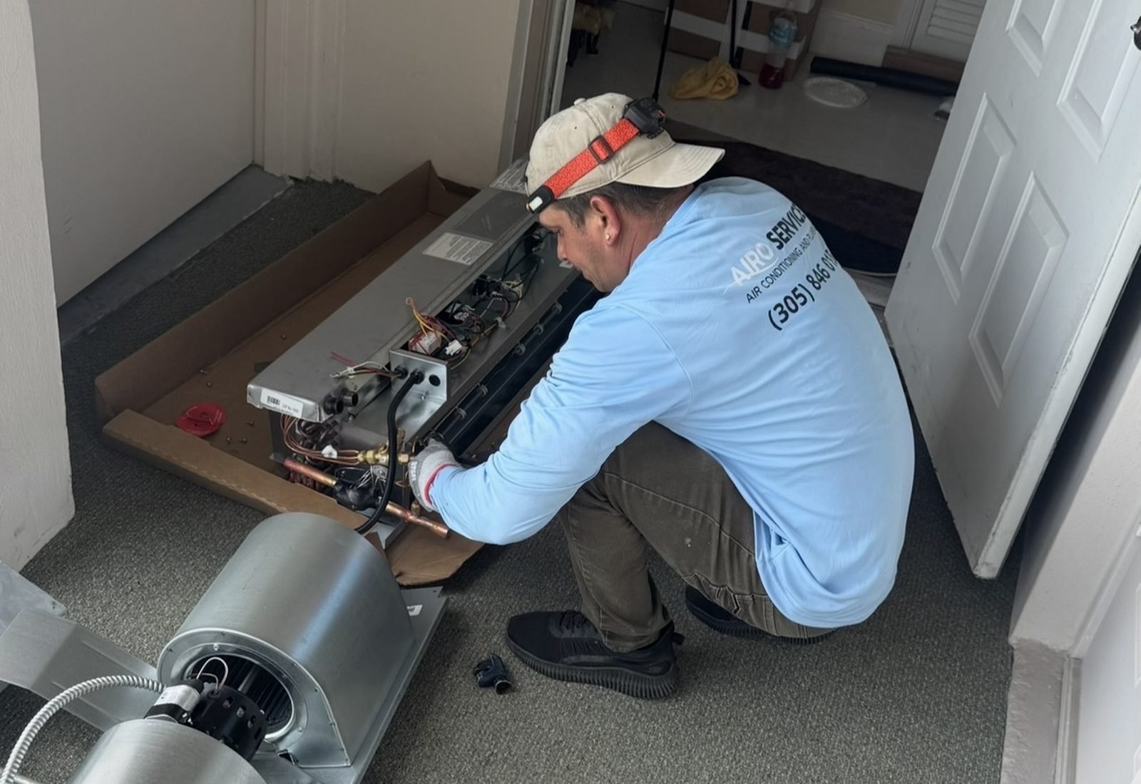 Air handler, blower assembly and sheet-metal ductwork during an Airo Service job in South Florida