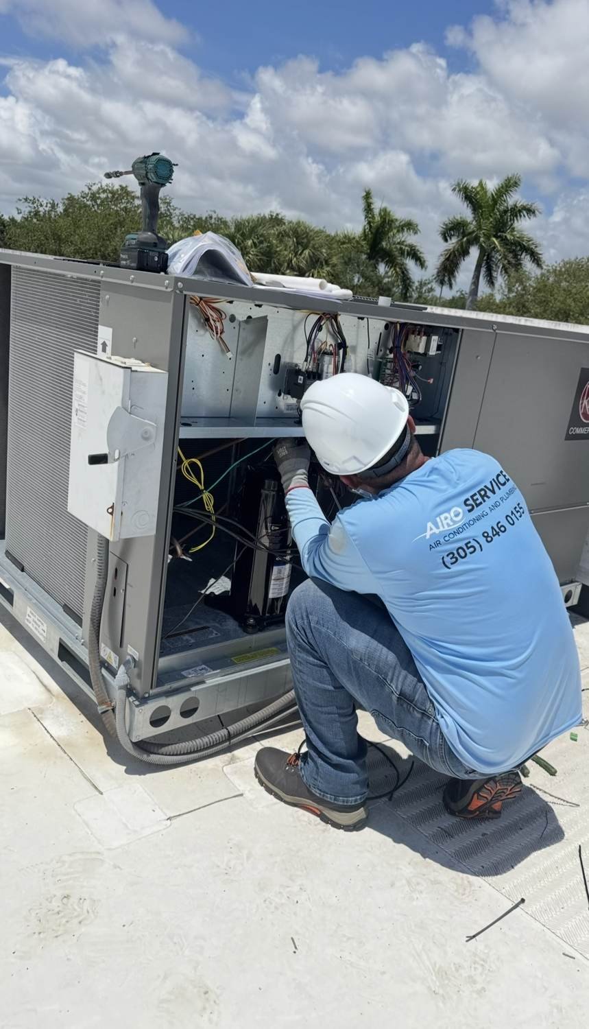 Airo Service technician working on a unit at a South Florida property